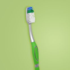 Vista al detalle de cepillo dental para adultos de color verde